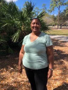 Profile picture of me outside in a park